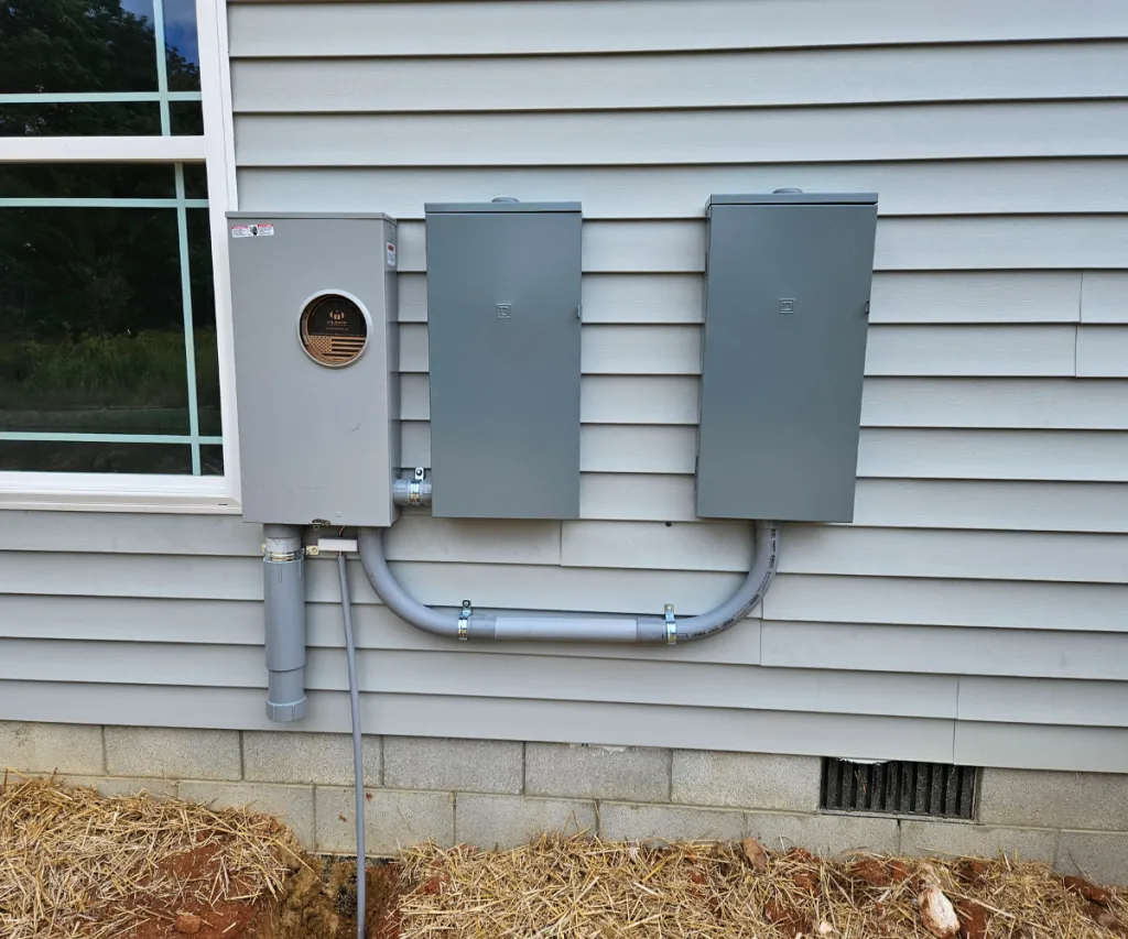 Meter base and disconnect boxes mounted on siding