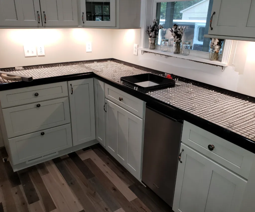 White shaker kitchen with black countertops